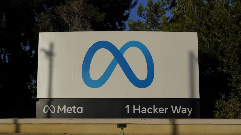 FILE - Meta's logo can be seen on a sign at the company's headquarters in Menlo Park, Calif., on Nov. 9, 2022. Irish regulators slapped Facebook parent Meta with a 265 million euro ($277 million) fine Monday, Nov. 28, 2022 the company's latest punishment for breaching strict European Union data privacy rules. (AP Photo/Godofredo A. V&aacute;squez, File)