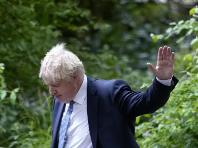 Britain's Prime Minister Boris Johnson waves as he walks down Downing Street after a press conference in London, Wednesday, May 25, 2022.A report into lockdown-breaching U.K. government parties says blame for a "culture" of rule-breaking in Prime Minister Boris Johnson's office must rest with those at the top. Senior civil servant Sue Gray's long-awaited report was published Wednesday.(AP Photo/Kirsty Wigglesworth)