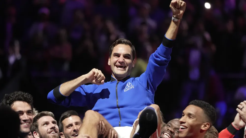 Team Europe's Roger Federer is lifted by fellow players after playing with Rafael Nadal in a Laver Cup doubles match against Team World's Jack Sock and Frances Tiafoe at the O2 arena in London, Friday, Sept. 23, 2022. Federer's losing doubles match with Nadal marked the end of an illustrious career that included 20 Grand Slam titles and a role as a statesman for tennis. (AP Photo/Kin Cheung)