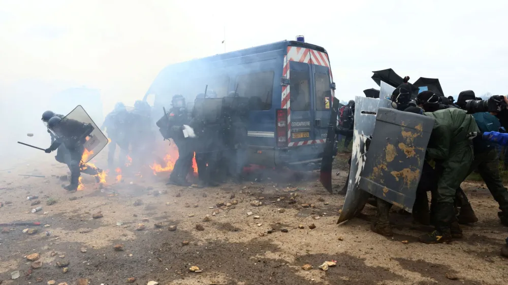 Protesters clash with the gendarmerie during a demonstration called by the collective "Bassines Non Merci" against the "basins" on the construction site of new water storage infrastructure for agricultural irrigation in western France, in Sainte-Soline, France March 25, 2023. REUTERS/Yves Herman