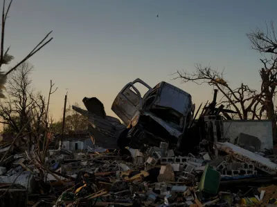 A vehicle sits on top of a pile of rubble after thunderstorms spawning high straight-line winds and tornadoes ripped across the state in Rolling Fork, Mississippi, U.S., March 25, 2023. REUTERS/Cheney Orr