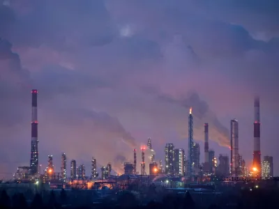 Flue gas and steam rise out of chimneys and smokestacks of an oil refinery during sunset on a frosty day in the Siberian city of Omsk, Russia, February 8, 2023. REUTERS/Alexey Malgavko