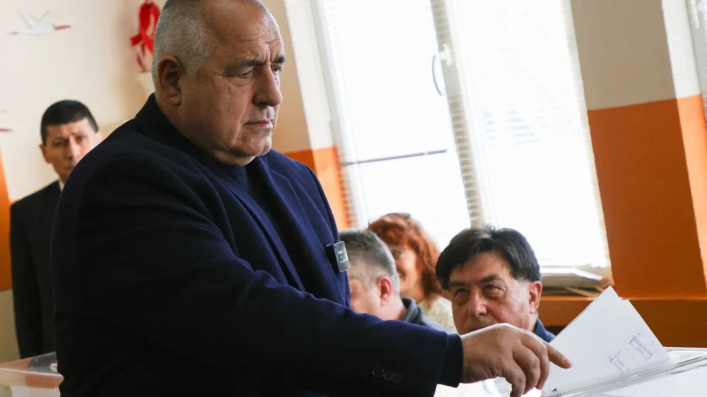 Boyko Borissov, former Bulgarian Prime Minister and leader of centre-right GERB party, casts his vote during the parliamentary election, in Sofia, Bulgaria, April 2, 2023. REUTERS/Stoyan Nenov