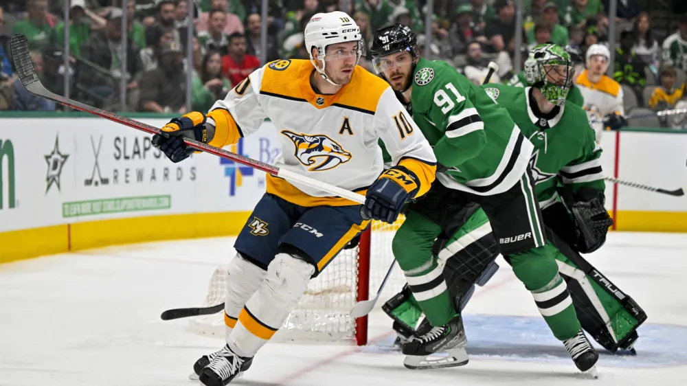 Apr 3, 2023; Dallas, Texas, USA; Nashville Predators center Colton Sissons (10) and Dallas Stars center Tyler Seguin (91) look for the puck in the Dallas zone during the first period at the American Airlines Center. Mandatory Credit: Jerome Miron-USA TODAY Sports