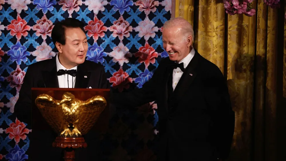 U.S. President Joe Biden reacts as South Korea's President Yoon Suk Yeol speaks during an official State Dinner in Washington, U.S. April 26, 2023. REUTERS/Evelyn Hockstein