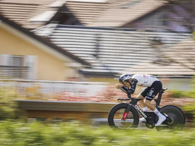 Juan Ayuso from Spain in action during the prologue, a 6,82 km race against the clock, at the 76th Tour de Romandie UCI World Tour Cycling race, in Le Bouveret, Switzerland, Tuesday, April 25, 2023. (Valentin Flauraud/Keystone via AP)