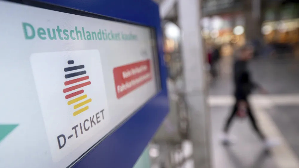 A notice for the Deutschlandticket (Germany Ticket) is displayed on a ticket vending machine at Frankfurt's main train station, Germany, Monday, May 1, 2023. Public transit companies in Germany say more than three million people have already snapped up a new ticket being launched Monday that allows them to use all local and regional trains, buses and metros across the country for 49 euros ($53.90) a month. (Sebastian Gollnow/dpa via AP)