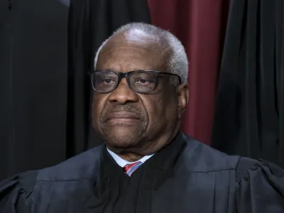 FILE - Associate Justice Clarence Thomas joins other members of the Supreme Court as they pose for a new group portrait, at the Supreme Court building in Washington, Oct. 7, 2022. A Republican megadonor paid two years of private school tuition for a child raised by Supreme Court Justice Clarence Thomas, who did not disclose the payments, a lawyer who has represented Thomas and his wife acknowledged Thursday. (AP Photo/J. Scott Applewhite, File)
