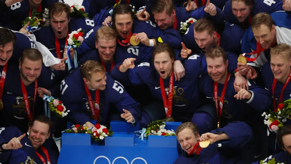 2022 Beijing Olympics - Victory Ceremony - Ice Hockey - Men's Gold Medal - National Indoor Stadium, Beijing, China - February 20, 2022. Finland players pose for a picture with their gold medals during the medal ceremony. REUTERS/Brian Snyder