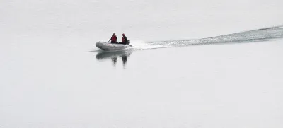 A police dingy navigates in the Arade dam near Silves, Portugal, Tuesday May 23, 2023. Portuguese police said they will resume searching for Madeleine McCann, the British toddler who disappeared in the country's Algarve region in 2007, in the next few days. Portugal's Judicial Police released a statement confirming local media reports that they would conduct the search at the request of the German authorities and in the presence of British officials. (AP Photo/Joao Matos)