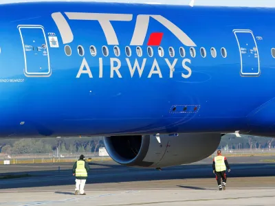 FILE PHOTO: An Italian carrier Italia Trasporto Aereo (ITA Airways) plane is checked by workers at Fiumicino airport in Rome, Italy, January 31, 2023. REUTERS/Remo Casilli/File Photo
