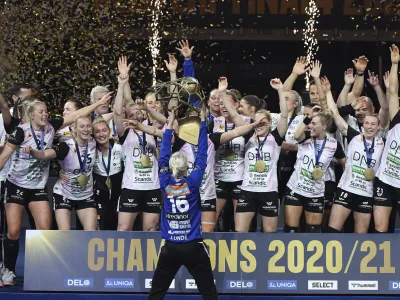 Players of Vipers Kristiansand celebrate with the trophy after they won women's handball Champions' League final match Vipers Kristiansand vs. Brest Bretagne Handball in Papp Laszlo Budapest Sports Arena in Budapest, Hungary, Sunday, May 30, 2021. (Tibor Illyes/MTI via AP)