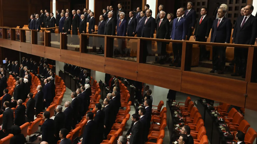Legislators elected to the Grand National Assembly of Turkey in the May 14 parliamentary elections attend their first parliamentary session to take the oath, in Ankara, Turkey, Friday, June 2, 2023. Turkish President Recep Tayyip Erdogan's ruling Justice and Development Party and its nationalist and Islamist allies have a majority in the 600-seat parliament, having won a total of 323 seats. Erdogan, who won a runoff presidential vote on May 28, formally starts his third presidential term following a ceremony on Saturday. (AP Photo/Ali Unal)