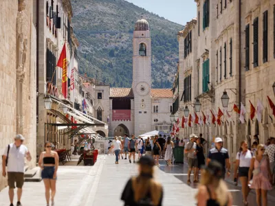 Tourists are seen at Stradun street in Dubrovnik, amid the spread of the coronavirus disease (COVID-19), Croatia, July 28, 2020. Picture taken July 28, 2020. REUTERS/Antonio Bronic