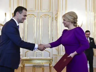 FILE - Slovakia's President Zuzana Caputova, right, appoints a caretaker government led by the economist and National Bank of Slovakia vice-chair Ludovit Odor in Bratislava, Monday, May 15, 2023. Slovakia's new government of technocrats lost a mandatory confidence vote in Parliament on Thursday. President Zuzana Caputova who swore in the 15-member Cabinet led by Prime Minister Ludovit Odor on May 15 has to dismiss it. (Jaroslav Novak/TASR via AP, File)