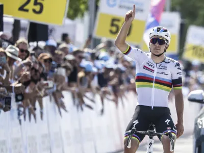 Remco Evenepoel from Belgium of Soudal-Quick Step crosses the finish line as winner of the seventh stage, a 174 km race from Tuebach to Weinfelden, at the 86th Tour de Suisse UCI World Tour cycling race, in Weinfelden, Switzerland, Saturday, June 17, 2023. (Gian Ehrenzeller/Keystone via AP)