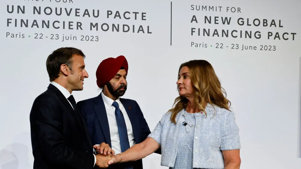 French President Emmanuel Macron, World Bank President Ajay Banga and U.S. philanthropist Melinda French Gates take part in a round table to discuss the global economy during the New Global Financial Pact Summit at the Palais Brongniart in Paris, France on June 22, 2023.   LUDOVIC MARIN/Pool via REUTERS