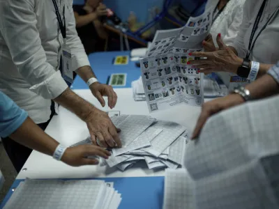 Electoral workers count ballots after the polls closed during general elections in Guatemala City, Sunday, June 25, 2023. (AP Photo/Santiago Billy)
