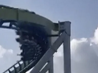 This image from video provided by Joey Mtnjunkie Puig shows a crack in a support pillar of the Fury 325 ride as a roller coaster passes by at North Carolina's Carowinds amusement park on Friday, June 30, 2023. (Joey Mtnjunkie Puig via AP)