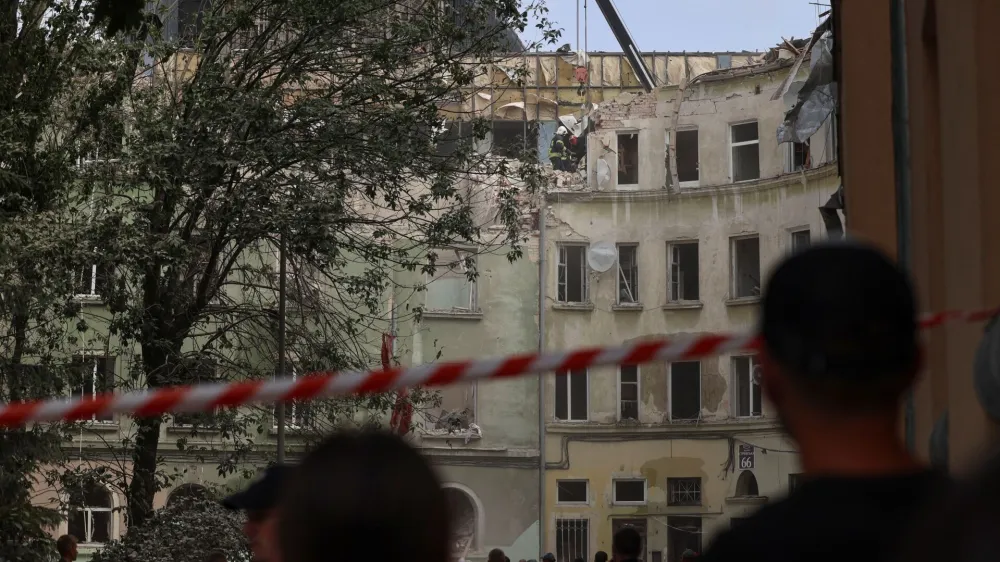 Rescuers work at a site of a residential building hit by a Russian missile strike, amid Russia's attack on Ukraine, in Lviv, Ukraine July 6, 2023. REUTERS/Roman Baluk