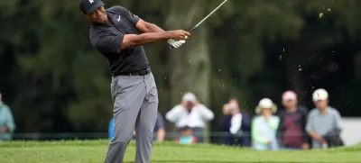 Sep 8, 2018; Newtown Square, PA, USA; Tiger Woods hits his approach shot on the 3rd hole during the third round of the BMW Championship golf tournament at Aronimink GC. Mandatory Credit: Bill Streicher-USA TODAY Sports