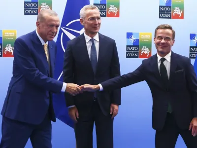 Turkey's President Recep Tayyip Erdogan, left, shakes hands with Sweden's Prime Minister Ulf Kristersson, right, as NATO Secretary General Jens Stoltenberg looks on prior to a meeting ahead of a NATO summit in Vilnius, Lithuania, Monday, July 10, 2023. (Yves Herman, Pool Photo via AP)