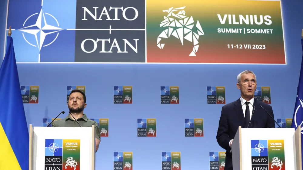 NATO Secretary General Jens Stoltenberg, right, and Ukraine's President Volodymyr Zelenskyy address a media conference during a NATO summit in Vilnius, Lithuania, Wednesday, July 12, 2023. NATO leaders gathered Wednesday to launch a highly symbolic new forum for ties with Ukraine, after committing to provide the country with more military assistance for fighting Russia but only vague assurances of future membership. (AP Photo/Mindaugas Kulbis)