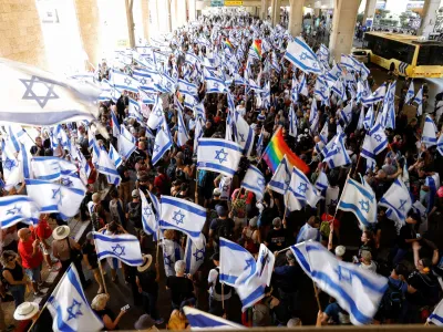 People demonstrate as a response to Israeli Prime Minister Benjamin Netanyahu and his nationalist coalition government's judicial overhaul, at Ben Gurion International Airport in Lod, Israel July 11, 2023. REUTERS/Amir Cohen