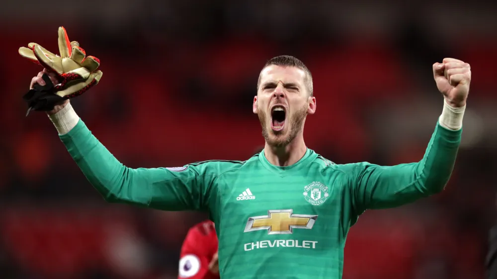 FILED - 13 January 2019, England, London: Manchester United goalkeeper David de Gea celebrates victory after the final whistle of the English Premier League soccer match between Tottenham Hotspur and Manchester United at Wembley Stadium. David de Gea signed a new contract Monday, tying him to the Premier League until at least 2023, with an option for an extra year. Photo: John Walton/PA Wire/dpa
