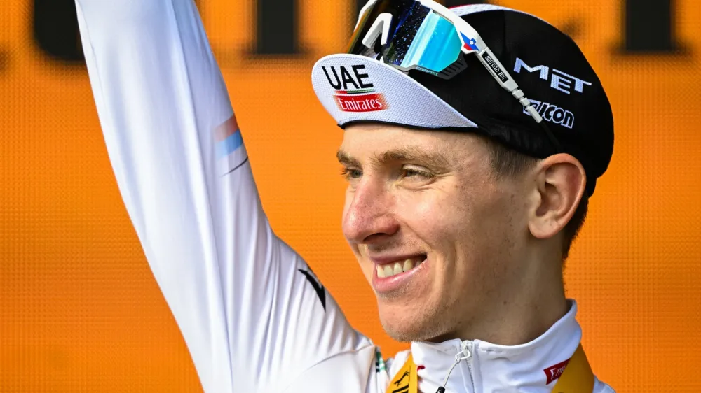 22 July 2023, France, Le Markstein Fellering: Slovenian cyclist Tadej Pogacar of UAE Team Emirates celebrates on the podium after winning the 20th stage of the 110th edition of the Tour de France cycling race, 133,5 km from Belfort to Le Markstein Fellering. Photo: David Pintens/Belga/dpa