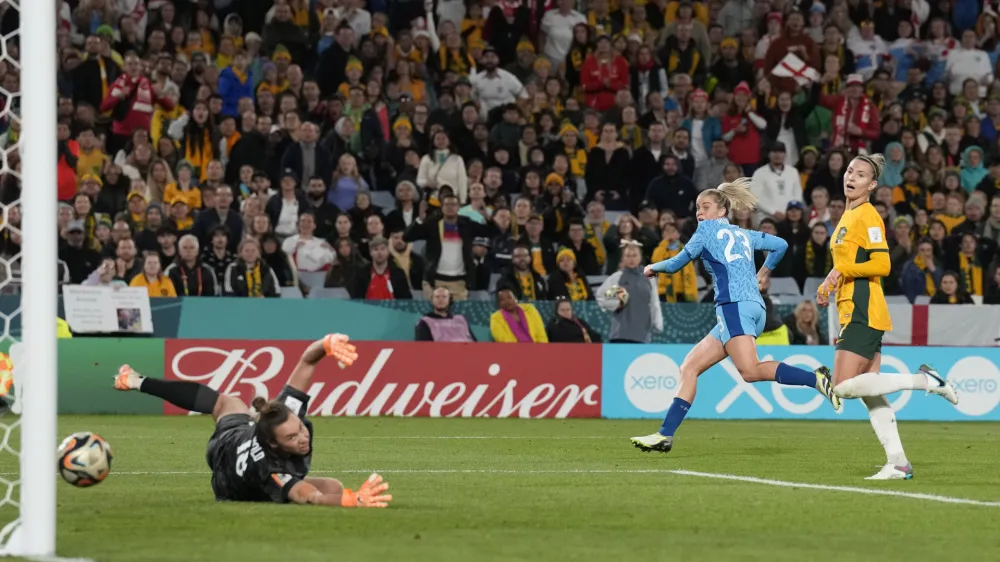 Australia's goalkeeper Mackenzie Arnold dives but fails to save the goal from England's Alessia Russo, second right, during the Women's World Cup semifinal soccer match between Australia and England at Stadium Australia in Sydney, Australia, Wednesday, Aug. 16, 2023. (AP Photo/Alessandra Tarantino)