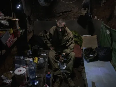 Ukrainian soldiers of the 53rd brigade in a trench at the frontline close to Donetsk, Ukraine, Saturday, Aug. 19, 2023. (AP Photo/Libkos)