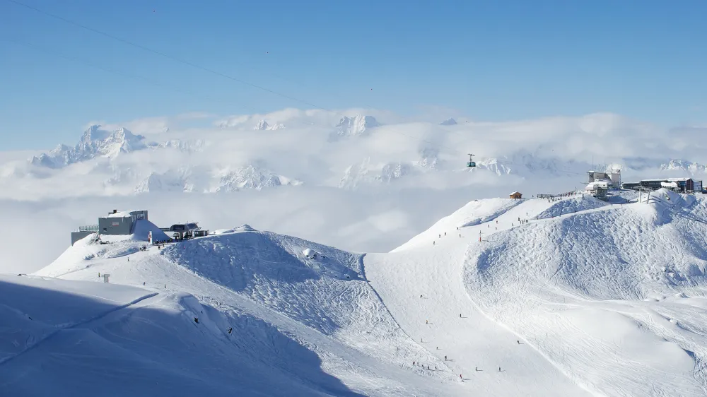 Cable car station on the top of swiss mountains with mont blanc on the background