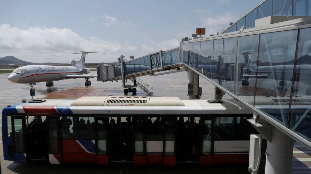 FILE PHOTO: An Air Koryo plane is reflected in a glass structure of the airport in Pyongyang, North Korea April 18, 2017.  REUTERS/Damir Sagolj/File Photo