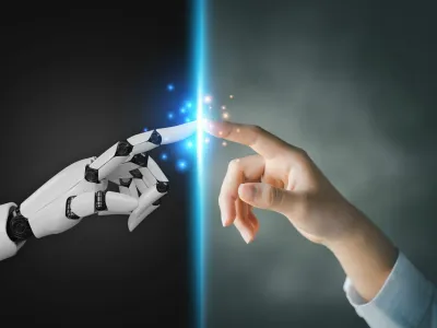 Robot and human hands pointing to each other, the idea of creating futuristic AI, intelligent systems to work instead of humans and do what humans can't. Creating innovative technology of the future.