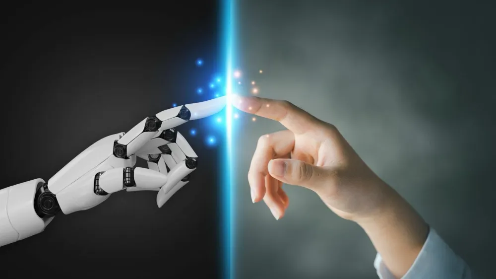 Robot and human hands pointing to each other, the idea of creating futuristic AI, intelligent systems to work instead of humans and do what humans can't. Creating innovative technology of the future.
