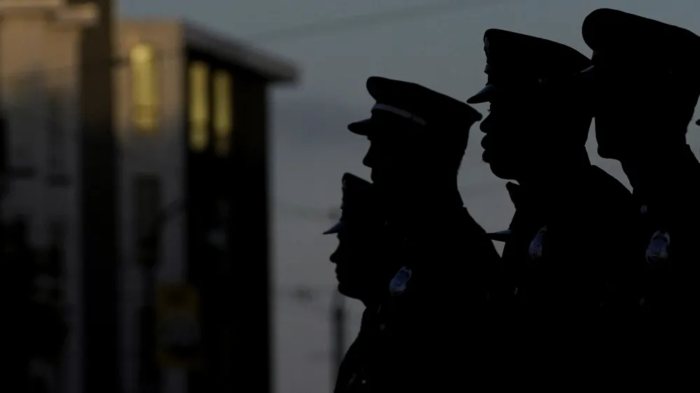 San Francisco Firefighters listen as the names of the firefighters and emergency responders who lost their lives on Sept. 11, 2001, are read at a fire station in San Francisco, Monday, Sept. 11, 2023. Americans are looking back on the horror and legacy of 9/11, gathering Monday, Sept. 11, 2023, at memorials, firehouses, city halls and elsewhere to observe the 22nd anniversary of the deadliest terror attack on U.S. soil.&nbsp;(AP Photo/Jeff Chiu)
