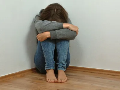 Lonely girl crying in the corner<br>depressed