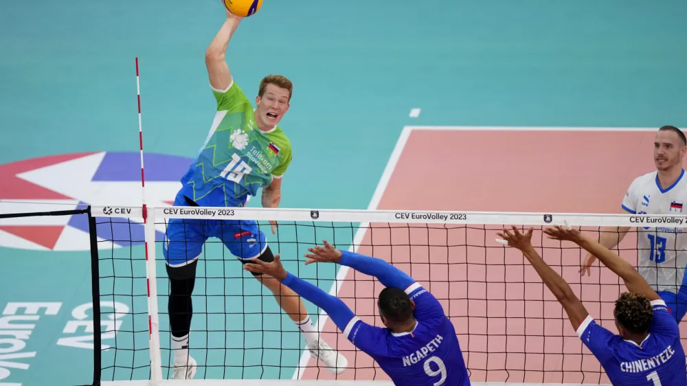 Slovenia's Rok Mozic, left, in action during the Men's European Volleyball bronze medal final between France and Slovenia, in Rome, Saturday, Sept. 16, 2023. (AP Photo/Andrew Medichini)
