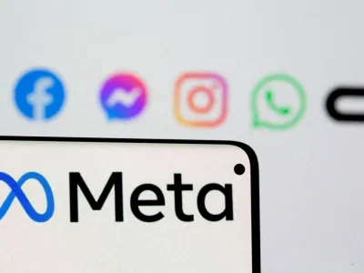 FILE PHOTO: Facebook's new rebrand logo Meta is seen on smartphone in front of displayed logo of Facebook, Messenger, Instagram, Whatsapp and Oculus in this illustration picture taken October 28, 2021. REUTERS/Dado Ruvic/Illustration/File Photo