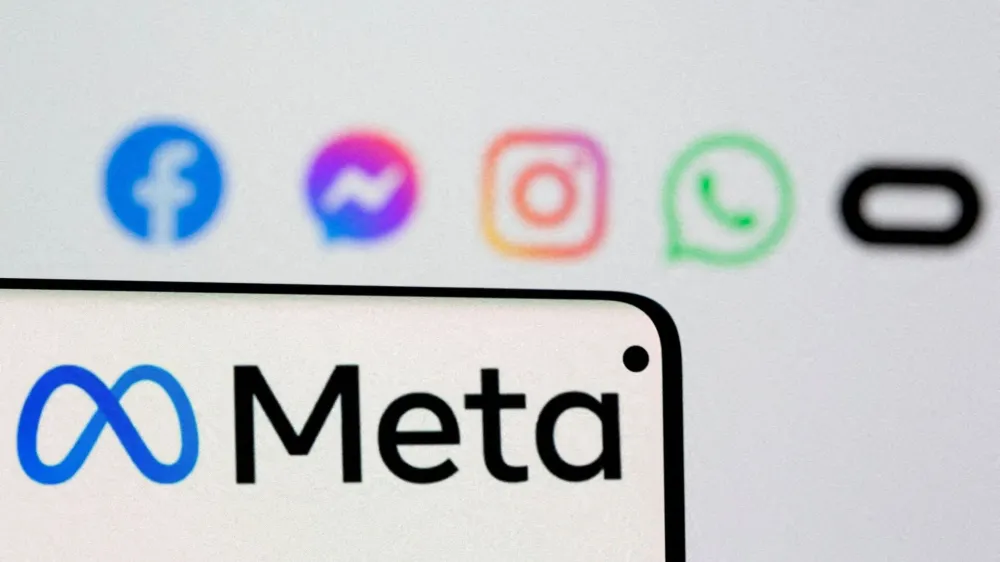 FILE PHOTO: Facebook's new rebrand logo Meta is seen on smartphone in front of displayed logo of Facebook, Messenger, Instagram, Whatsapp and Oculus in this illustration picture taken October 28, 2021. REUTERS/Dado Ruvic/Illustration/File Photo