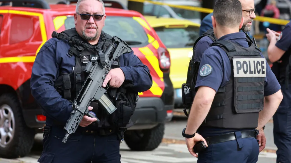 French police secure the area after a teacher was killed and several people injured in a knife attack at the Lycee Gambetta-Carnot high school in Arras, northern France, October 13, 2023. REUTERS/Pascal Rossignol