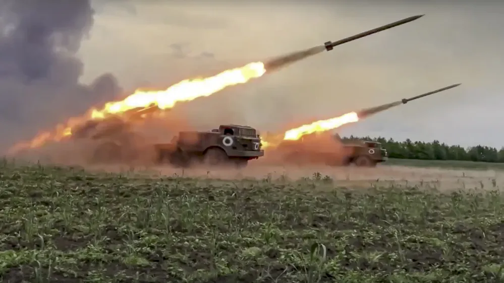 In this handout photo released by Russian Defense Ministry Press Service released on Wednesday, June 1, 2022, The Russian military's Uragan multiple rocket launchers fire rockets at Ukrainian troops at an undisclosed location. (Russian Defense Ministry Press Service via AP)