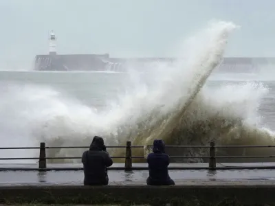 Waves crash over Newhaven Lighthouse and the harbour wall in Newhaven, southern England, Thursday, Nov. 2, 2023. Winds up to 180 kilometers per hour (108 mph) slammed France's Atlantic coast overnight as Storm Ciaran lashed countries around western Europe, uprooting trees, blowing out windows and leaving 1.2 million French households without electricity Thursday. Strong winds and rain also battered southern England and the Channel Islands, where gusts of more than 160 kph (100 mph) were reported. (AP Photo/Kin Cheung)