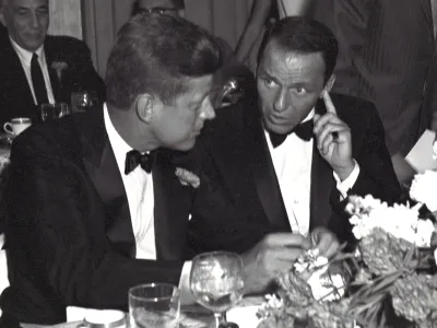 US Senator (and future US President) John F Kennedy (1917 - 1963) (left) and entertainer Frank Sinatra (1915 - 1998) attend a black tie, Democratic Committee Dinner at the Beverly Hilton Hotel, Los Angeles, California, July 10, 1960. (Photo by Benjamin E. 'Gene' Forte/CNP/Getty Images)