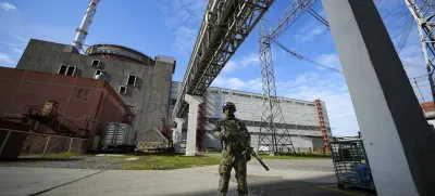 FILE - A Russian serviceman guards an area of the Zaporizhzhia Nuclear Power Station in territory under Russian military control, southeastern Ukraine, on May 1, 2022. Ukraine and Russia accused each other Wednesday, July 5, 2023, of planning to attack the power plant, which is occupied by Russian troops, but neither side provided evidence to support their claims. (AP Photo, File)