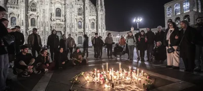 FILE - People attend a candlelight vigil for 22-year-old Giulia Cecchettin, allegedly killed at the hands of her possessive ex-boyfriend, in front of the Milan Duomo Cathedral, Italy, Sunday, Nov. 19, 2023. Outrage over violence against women is mounting in Italy, with students leading the way. Young people across the country have taken to pounding on classroom desks in unison to demand an end to the slayings of women by men and to root out corrosive, patriarchal attitudes that have long been a part of Italian society. Opposition lawmakers did the same in parliament. (Marco Ottico/LaPresse via AP, file)