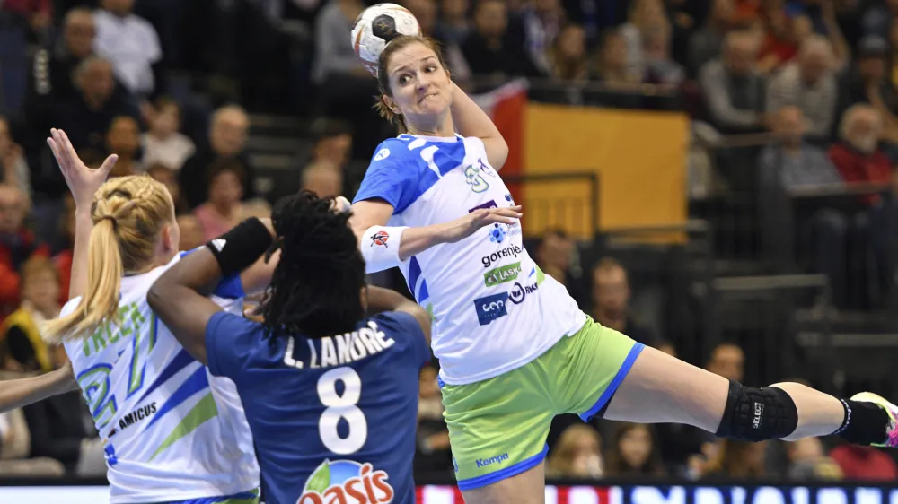Slovenia's Ana Gros throws for goal against France's Laurisa Landre during the women's handball world championships match between France and Slovenia at Arena Trier in Trier, Germany, Saturday Dec. 2, 2017. (Harald Tittel/dpa via AP)