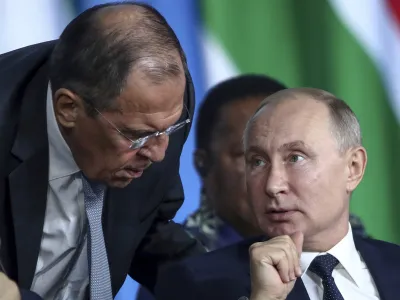 FILE - Russian President Vladimir Putin, right, listens to Russian Foreign Minister Sergey Lavrov, top, as Egyptian President Abdel Fattah el-Sisi sits next during a plenary session at the Russia-Africa summit in the Black Sea resort of Sochi, Russia, Oct. 24, 2019. In his role for nearly 18 years, Lavrov, 71, has seen relations with the West shift from near-friendly to openly hostile, plummeting to a catastrophic new low with the Russian war against Ukraine. The invasion prompted the European Union to freeze the assets of both Putin and Lavrov, among others &acirc;&euro;" an unprecedented blow to Moscow's pride. (Valery Sharifulin, TASS News Agency Pool Photo via AP, File)