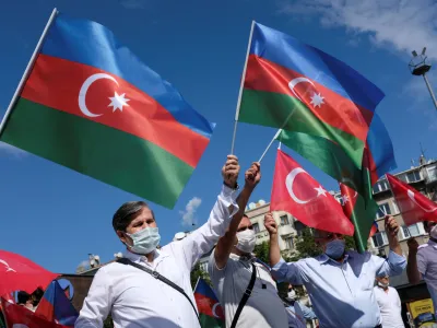 Demonstrators wave flags of Azerbaijan and Turkey during a protest against Armenia in Istanbul, Turkey October 1, 2020. REUTERS/Murad Sezer